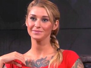 Check Out This Drop Dead Gorgeous Tattooed Blonde BDSM Slut In A Sexy Red Dress. She Enjoys Getting Tied Up And Having This Huge Cock Rammed Down Her Throat So She Can Gag On It Porn