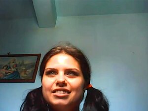 Brunette teen smacks her slit on a webcam